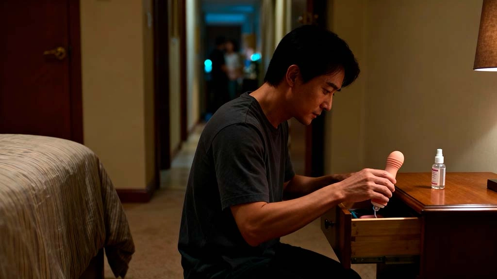 quiet sex toys for men man storing discreet toy in bedside drawer in shared apartment